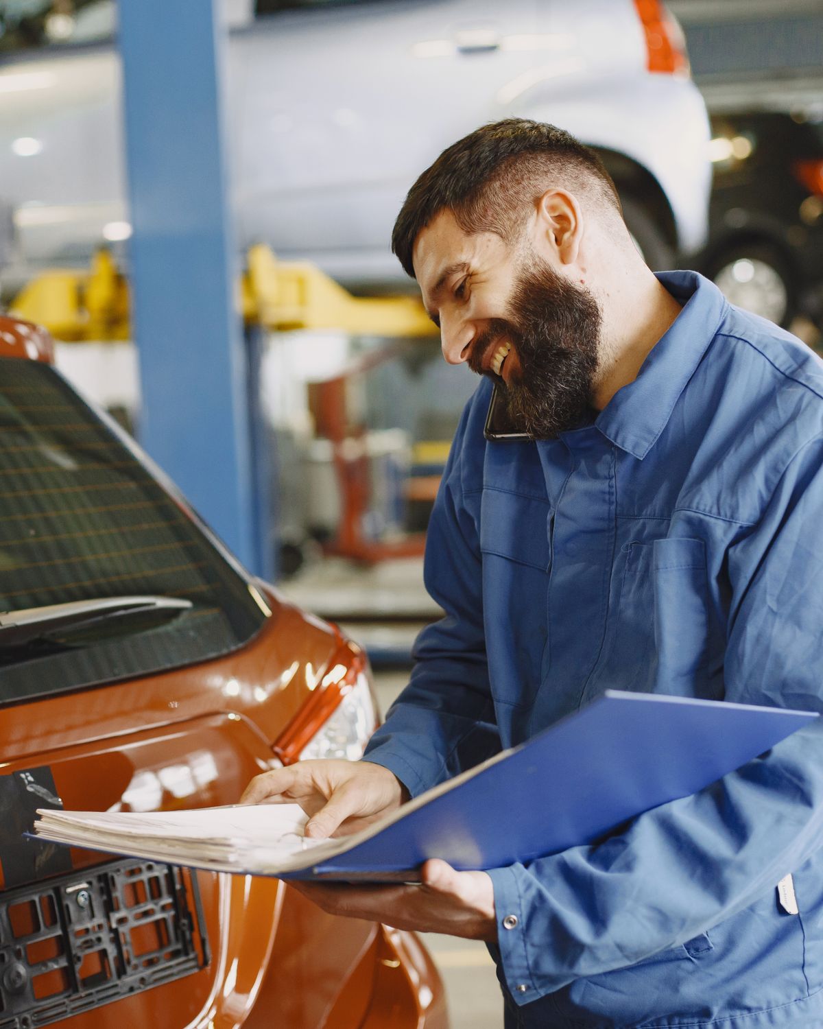 Technician documenting a vehicle inspection