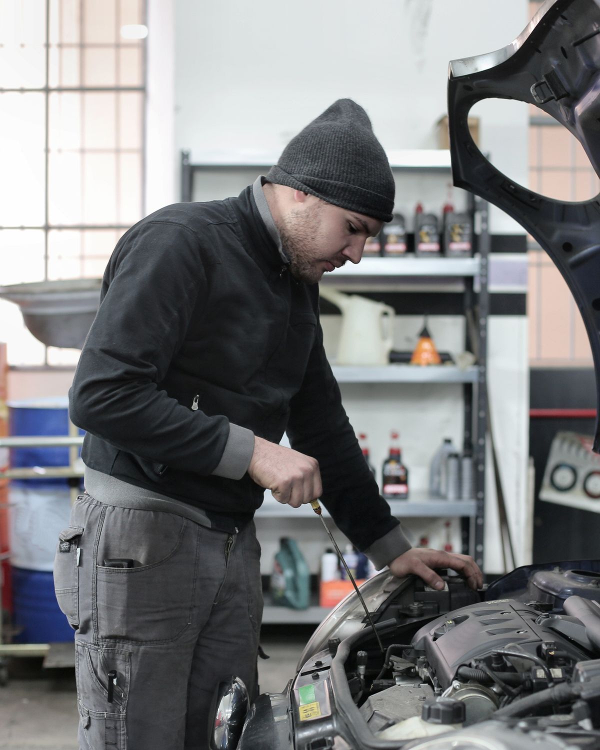 Mechanic servicing an engine fuel system