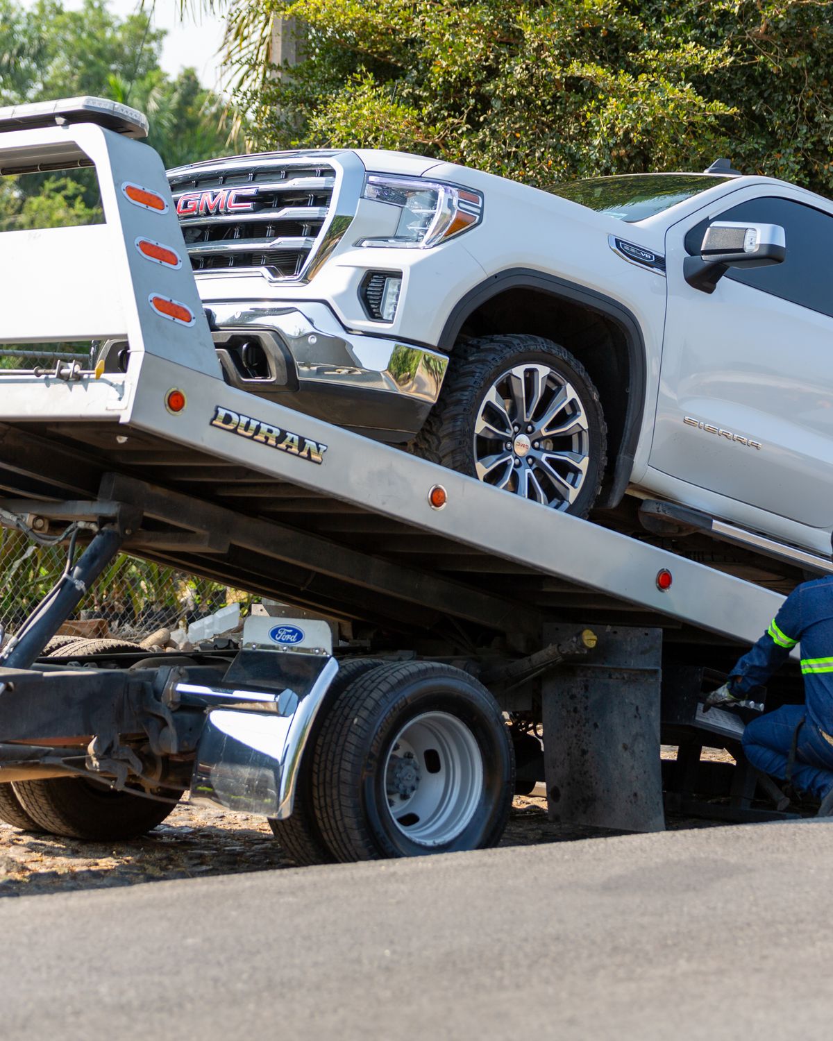 Vehicle being transported by a recovery truck